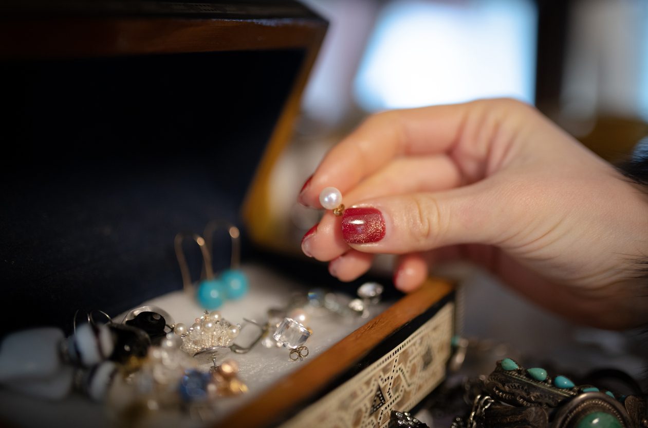 Women's hands choosing accessories